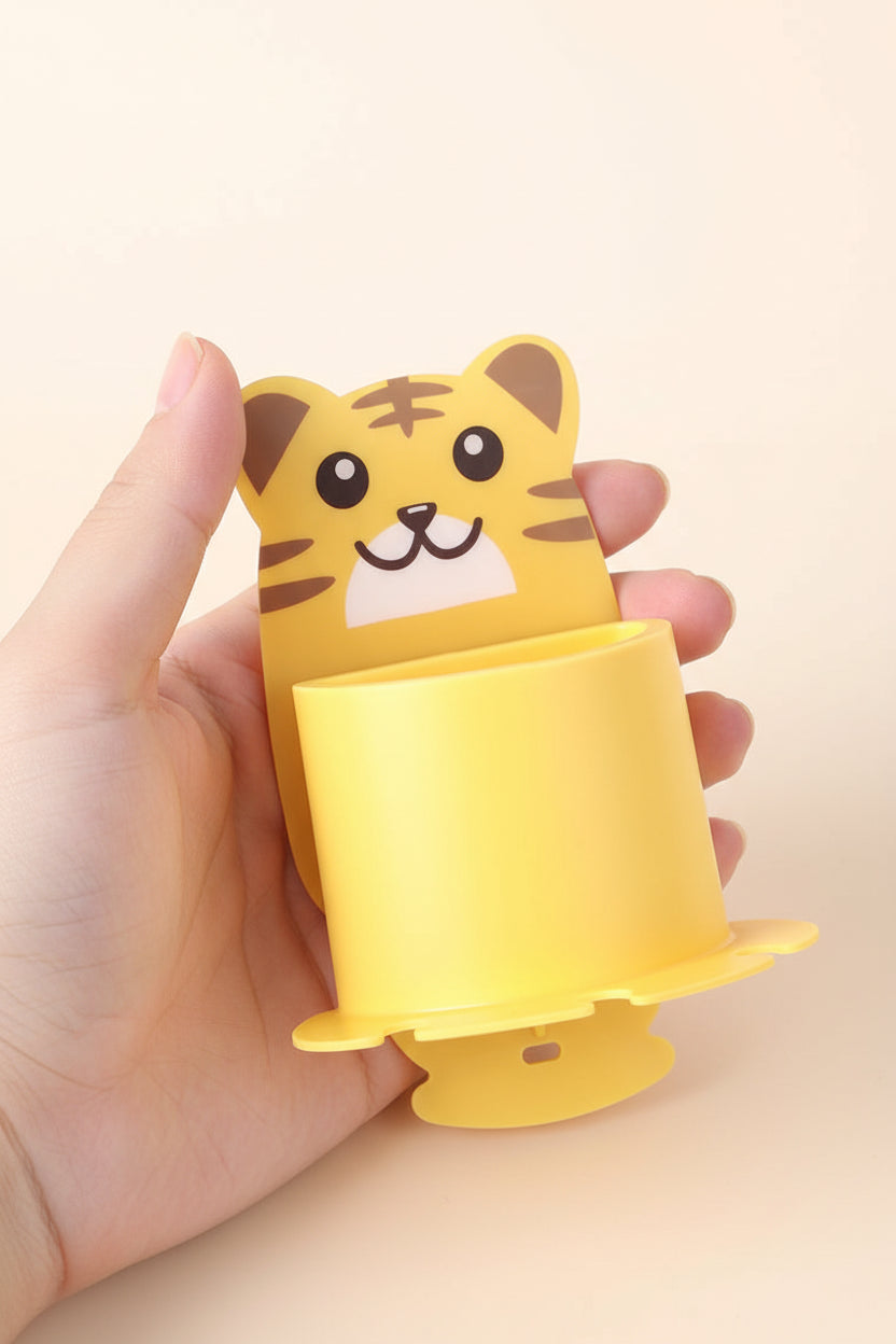Yellow animal-shaped object with a tiger design on a beige background