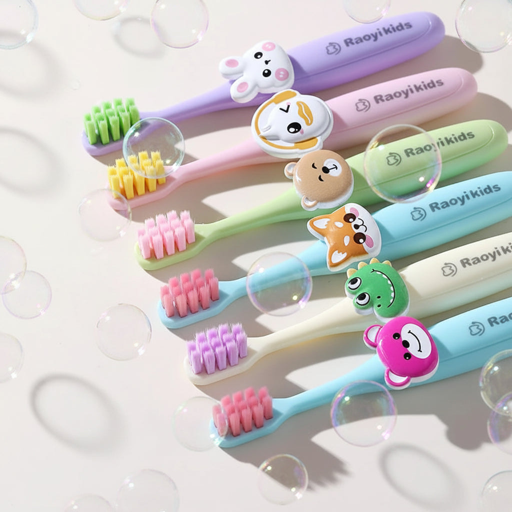 Set of colorful children's toothbrushes with cartoon handles on a white background