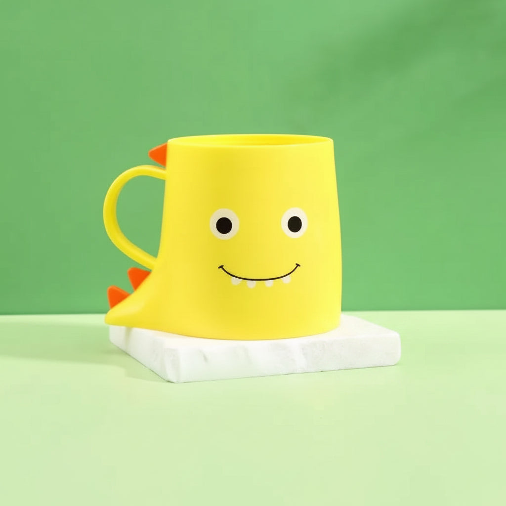Yellow mug with a smiley face design on a green background