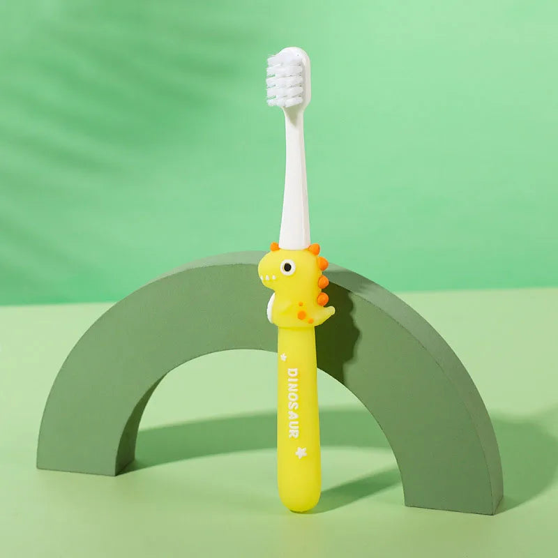 Children's dinosaur-themed toothbrush on a green arch with a green background